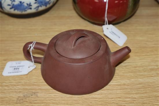 A Chinese squat baluster vase, crackle-glazed in green and red, a blue and white ginger jar and cover and a redware teapot